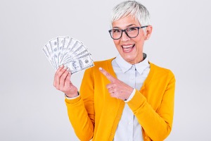 Mature Woman Holding Money 